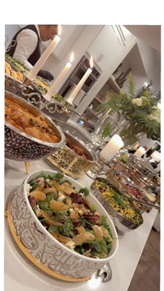 a buffet table filled with lots of different types of food