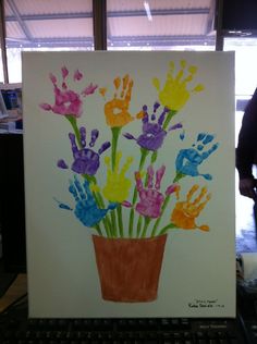 handprints are displayed on a white canvas with flowers in it and the words woodhead, iguateng