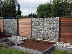 a fence made out of rocks and wood