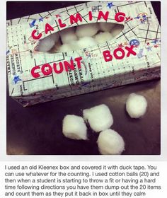 a box filled with cotton balls sitting on top of a table