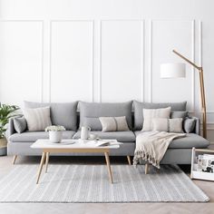 a living room with a gray couch and coffee table