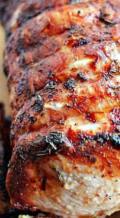 a close up of meat on a cutting board