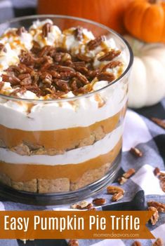 an easy pumpkin pie trifle in a glass dish with pecans on the side