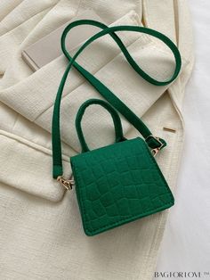 BagForLove - Compact Crocodile Embossed Flap Bag - Stylish and Sleek Product Description Color Green Type Square Bag Bag Size Mini Strap Type Adjustable Pattern Type Plain Closure Type Flap Style Funky Features Lightweight Composition 100% Polyester Material Polyester Size Chart INCH CM Strap Length Bag Length Bag Width Bag Height Handle Height 33.5 inch 4.7 inch 1.8 inch 4.1 inch 3.1 inch Strap Length Bag Length Bag Width Bag Height Handle Height 85 cm 12 cm 4.5 cm 10.5 cm 8 cm Details Pictures Green Satchel Bag With Solid Color, Green Crocodile Pattern Shoulder Bag, Green Solid Color Satchel Bag, Green Crocodile Pattern Handheld Bag, Trendy Green Crocodile Pattern Bag, Casual Rectangular Bag With Crocodile Pattern, Green Crocodile Pattern Tote Bag, Green Crocodile Pattern Shoulder Bag For Shopping, Square Bags With Crocodile Pattern