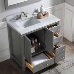 a bathroom vanity with two drawers and a sink in the middle, next to a mirror