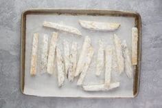 fish fillets on a baking sheet ready to be cooked