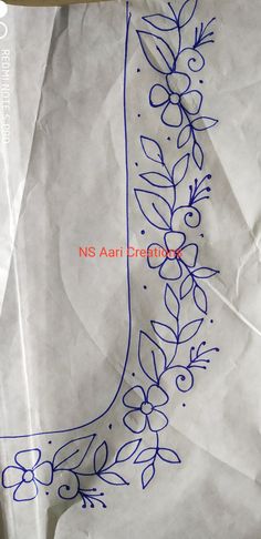 a piece of white paper with blue ink on it that has flowers and leaves drawn on it