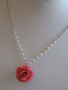 "Real Rose Necklace - Real Pink Miniature Rose preserved in resin. It is suspended from a Sterling Silver Chain accented with tiny White Freshwater Pearls. Rose is approximately 1\" - 1.25\" Sterling Silver Chain and Findings 17\" Length Each rose is unique so the one you will receive, may vary slightly from the one pictured. This is a stock photo. Be sure to check out my Floral Collection for similar items. http://www.etsy.com/shop/mcstoneworks?section_id=6939810" Pearl Necklace Real, Coral Collection, Wedding Flower Jewelry, Miniature Rose, Real Flower Necklace, Pink Pearl Necklace, Real Pearl Necklace, Jewelry Nature, Latest Simple Mehndi Designs