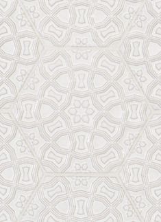 a white wallpaper with an intricate design