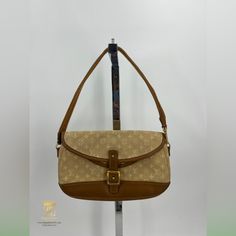 Louis Vuitton Marjorie Bag Beige Mini Lin Lv Monogram With Tan Leather Trim And Gold Hardware Date Code:Th1024 Approx 10x2x6.5” Strap Drop Is Approx 7”- Removable But Not Adjustable Double Flap Interior 2 Large Compartments With No Pockets Functional Front Closure Item Shows Signs Of Wear From Normal Use- Staining On Interior & Exterior, Dirty; Scratches And Scuffs On Leather Trim, Dents On Front Closure Etc Please Refer To Photos For Further Details In Store And Website For $390 Zeb82778 Louis Vuitton Mini, Bags Louis Vuitton, Lv Monogram, Leather Trim, Tan Brown, Tan Leather, Leather Trims, Gold Hardware, Interior Exterior