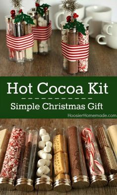 hot cocoa kit with christmas decorations and candy in glass jars on a wooden table next to mugs