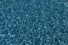 an overhead view of the water in a swimming pool