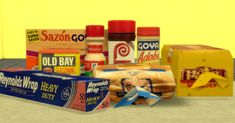 an assortment of food items are displayed on a countertop in front of a yellow wall