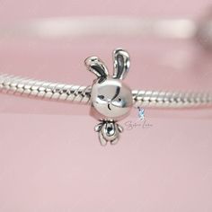 This is charm only, bracelet is sold separatelyIndulge in the adorable charm of our sterling silver rabbit bead charm! Made with solid 925 sterling silver and coated in platinum, these charms are guaranteed to be sturdy and intricately designed. Whether you're adding to your current charm bracelet or starting a new one from our collection, these charming bunny animal charms are a must-have for any lover of cute and stylish jewelry. Material: 925 sterling silverFinish: platinum plateDimension: 0. Silver Bunny Design Jewelry For Gifts, Silver Bunny Design Jewelry Gift, Silver Jewelry With Bunny Design For Gift, Cute Silver Dangle Charms, Cute Silver Charms For Gifts, Rabbit Charm, Cute Rabbit, Stylish Jewelry, Sterling Silver Charm