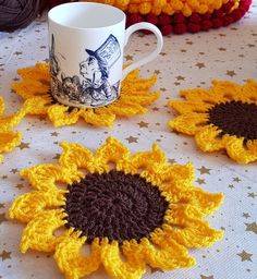 crocheted sunflower coasters and coffee cup on a table