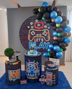 a birthday party with balloons and games on display