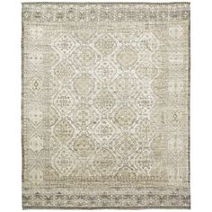 an antique rug with white and beige colors