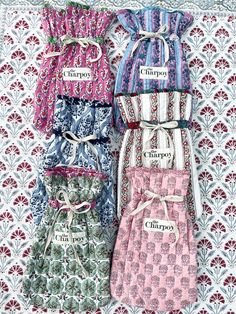 four different styles of women's aprons on display