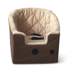 a brown and white dog bed that is shaped like a boat