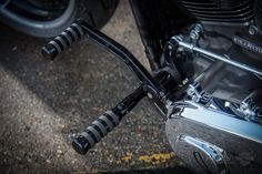 the front end of a motorcycle parked in a parking lot