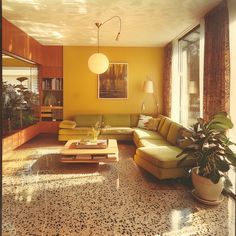 a living room filled with lots of furniture next to a large glass window and potted plant