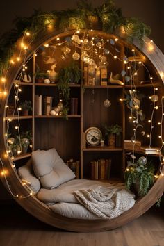 a circular bed with lots of lights on the shelves and pillows in front of it