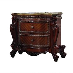 an ornate wooden cabinet with two drawers and marble top on the bottom, against a white background