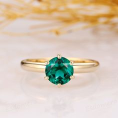 * Note: Please contact us before ordering if you need to receive the package on a specific date. If you want the ring to be made with emerald stone, please click the following listing:  https://www.etsy.com/listing/457475080/solitaire-moissanite-ring-round-cut-1ct? ------------------------------------------------------------ ※ Metal Type: Solid 10k/14k/18k (white/yellow/rose) gold. ※ Center Stone: Lab Created Emerald ※ Center Carat Weight: Round Cut 1.00ct (6.5mm) ※ Color: Green-5A ※ Clarity: VV Gift Emerald Ring With Round Stone, Emerald Ring With Round Stone For Gift, Emerald Birthstone Ring Gift, Round Emerald Ring Gift, Gold Emerald Ring For May Birthstone In Round Shape, Faceted Round Emerald Ring Gift, 14k Gold Emerald Ring With Round Stone, Emerald Birthstone Ring In White Gold, Round Cut, Gold Emerald Ring For May Birthstone, Round Shape