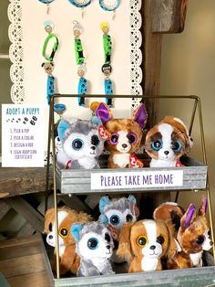 there are many stuffed animals on display in the store with tags attached to their ears