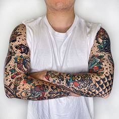 a man with many tattoos on his arms