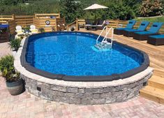 an above ground pool surrounded by lounge chairs