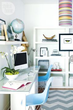 a home office with desk, chair and bookshelf