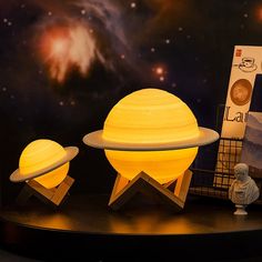 the solar system is being displayed in front of an image of saturn and its satellites