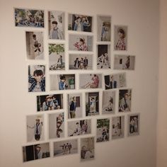 a white wall with many pictures on it