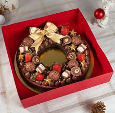 a decorated chocolate cake in a red box