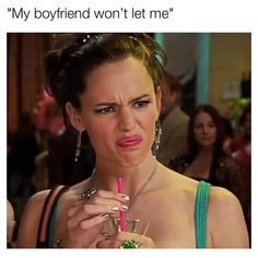 a woman holding a drink in her hand and making a face with the caption, my boyfriend won't let me