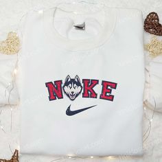 UConn Huskies x Nike Embroidered Shirt, NCAA Sports Embroidered Hoodie, Best Gift Idea Embroidered White College Hoodie, College Fan Apparel Hoodie With Embroidered Logo, Crew Neck Hoodie With Embroidered Logo For College, Cotton Sports Hoodie With Embroidered Graphics, White Sporty Hoodie With Embroidered Text, Sporty White Hoodie With Embroidered Text, Cotton Sweatshirt With Embroidered Graphics For Sports Season, White Embroidered Collegiate Sweatshirt, Collegiate Cotton Hoodie With Embroidered Logo