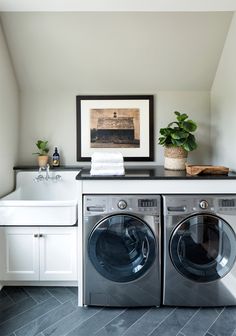 a washer and dryer in a small room