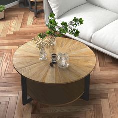 a coffee table with two vases on it in the middle of a living room