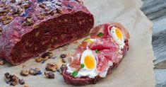 a piece of meat with eggs and nuts on it