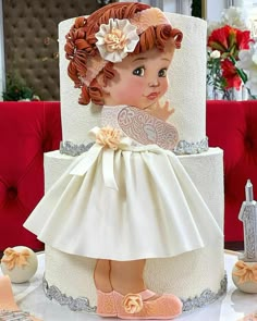 there is a cake with a doll on it