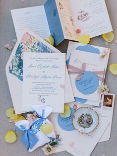 the wedding stationery is laid out on the table