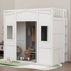 a white doll house with stuffed animals inside