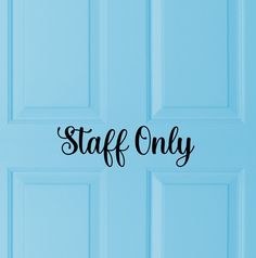 a blue door with the words staff only written on it in cursive font