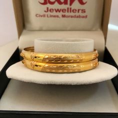 "Please contact us for any discounts or offers that are available on this item. As these gold bangles are very light in weight, after making these bangles, we put a protective metal bangle on the inner surface of the original gold bangles, as shown in the 4th image, this provides strength & shape to the bangles. Please Note:- The bangles are made out of Real Solid Gold & the metal bangles are just for support & durability. All Sizes available. We take absolute care of precious jewels Metal Bangles, Assalamualaikum Image, The Bangles, Yellow Gold Bangle, Good Music Quotes, Precious Jewels, Gifts For My Boyfriend, Vintage Bracelets, Gold Bangles