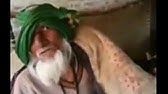 an old man with a green turban and white beard