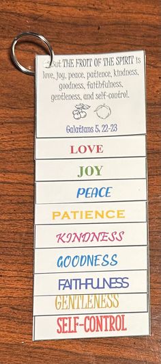 a key chain with the words love, peace, patience, goodness, godlessness and self - control on it