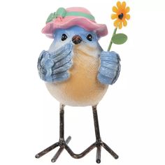 a blue bird with a pink hat holding a flower