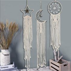 three white dream catchers hanging on the wall