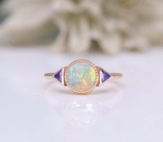 This ring can be made with your desired gemstone as well. If you would prefer a custom ring, please contact us before purchase. You You may also visit our following shops for varieties of collection :- ★ ★ ★ ★ ★ ★ ★ ★ ★ https://www.etsy.com/shop/OGofJewelry https://www.etsy.com/shop/BeckyBjewelry https://www.etsy.com/shop/TravelBugJewelry https://www.etsy.com/shop/BellaLaBellaJewelry https://www.etsy.com/shop/WanderlustJewelryArt https://www.etsy.com/shop/BloozieBlueJewelry ★ ★ ★ ★ ★ ★ ★ ★ ★ Thi Art Deco Opal Ring For Anniversary, Art Deco Round Sapphire Gemstone Ring, Art Deco Multi-stone Sapphire Ring, Art Deco Gold Opal Ring, Gold Art Deco Opal Ring, Art Deco Opal Ring With Round Gemstone, Art Deco Round Opal Ring, Art Deco Diamond Ring With Accent Stones, Art Deco Round Sapphire Ring Gift